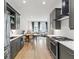 A modern kitchen extends to a living and dining area, creating an open concept living space at 658 Bull Se St, Atlanta, GA 30315