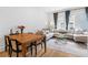 Cozy living room featuring a comfortable sofa, wooden table, and large windows at 658 Bull Se St, Atlanta, GA 30315
