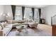 A bright living room features a large comfortable sofa, area rug, and large windows at 658 Bull Se St, Atlanta, GA 30315