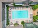 Aerial view of a community swimming pool surrounded by lounge chairs and lush landscaping between apartment buildings at 658 Bull Se St, Atlanta, GA 30315