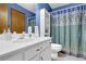 Bathroom with a white vanity, white toilet, and shower featuring a patterned curtain at 680 Spirit Falls Way, Johns Creek, GA 30022