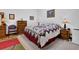 Comfortable bedroom with a stylish quilt, classic furniture, and ample natural light at 680 Spirit Falls Way, Johns Creek, GA 30022