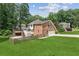 Expansive backyard features a deck, screened porch, and patio area at 742 Maggie Nw Ct, Kennesaw, GA 30144