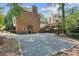A large backyard featuring multiple levels of patio and decks, plus stone landscaping at 742 Maggie Nw Ct, Kennesaw, GA 30144