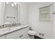 Bathroom with vanity, granite countertop, modern faucet and tile flooring at 742 Maggie Nw Ct, Kennesaw, GA 30144