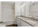Bathroom features a granite vanity, tiled floors, and a shower and tub combination at 742 Maggie Nw Ct, Kennesaw, GA 30144