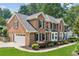 Elegant brick home with a two-car garage and well-manicured landscaping at 742 Maggie Nw Ct, Kennesaw, GA 30144