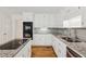Kitchen with granite countertops, stainless steel appliances and white cabinets at 742 Maggie Nw Ct, Kennesaw, GA 30144