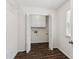Laundry room with white cabinetry and tile flooring, conveniently located at 742 Maggie Nw Ct, Kennesaw, GA 30144