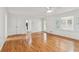 Open living room with hardwood floors, recessed lighting and view of back yard through the sunroom at 742 Maggie Nw Ct, Kennesaw, GA 30144