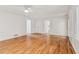 Bright living room with hardwood floors, neutral walls, and access to other areas of the house at 742 Maggie Nw Ct, Kennesaw, GA 30144
