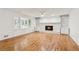 Spacious living room with hardwood floors, fireplace, and built-in shelves at 742 Maggie Nw Ct, Kennesaw, GA 30144