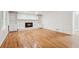 Open-concept living room featuring hardwood floors, fireplace, and ample natural light at 742 Maggie Nw Ct, Kennesaw, GA 30144