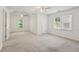 Large bedroom with plush carpet, neutral walls, and a vaulted ceiling, providing a tranquil retreat at 742 Maggie Nw Ct, Kennesaw, GA 30144
