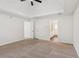Large main bedroom with new carpet, ceiling fan, and bathroom access at 742 Maggie Nw Ct, Kennesaw, GA 30144