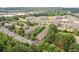 Scenic aerial view of a community with lush green trees and well-maintained apartment buildings at 1464 Dolcetto Trce, Kennesaw, GA 30152