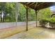 Covered back patio area offering an outdoor space for relaxation and entertaining at 1464 Dolcetto Trce, Kennesaw, GA 30152
