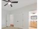 Bright bedroom with a ceiling fan, and an ensuite bathroom with a wood grain vanity at 1464 Dolcetto Trce, Kennesaw, GA 30152