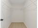 Walk-in closet with wire shelving and neutral carpet at 1464 Dolcetto Trce, Kennesaw, GA 30152
