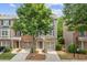 Attractive townhome with a blend of brick and siding, featuring attached garages and well-kept landscaping at 1464 Dolcetto Trce, Kennesaw, GA 30152