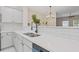 Modern kitchen featuring bright quartz countertops and stainless steel appliances at 1464 Dolcetto Trce, Kennesaw, GA 30152