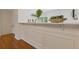 Stylish living space with wall paneling, and a breakfast bar featuring lovely plant decor at 1464 Dolcetto Trce, Kennesaw, GA 30152