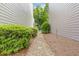 Side yard path featuring gravel and stone pavers, lined with lush shrubbery at 1464 Dolcetto Trce, Kennesaw, GA 30152