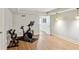 Basement area with stationary bike, dumbbells, and wood-look flooring, perfect for a home gym at 3120 Mary Dr, Marietta, GA 30066