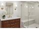 Modern bathroom featuring a glass shower, vanity, and stylish sconces at 3120 Mary Dr, Marietta, GA 30066