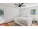 Bright bedroom features hardwood floors, ceiling fan, and access to a private balcony at 3120 Mary Dr, Marietta, GA 30066