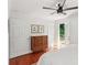 Bedroom with hardwood flooring, ceiling fan, and a sliding door to the balcony at 3120 Mary Dr, Marietta, GA 30066