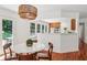 Bright dining room features a modern light fixture and access to the outdoor patio at 3120 Mary Dr, Marietta, GA 30066