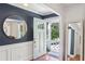 Stylish entryway features fresh white molding, wood floors, and an open doorway at 3120 Mary Dr, Marietta, GA 30066
