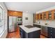 Open kitchen with stainless steel appliances, center island, and wooden cabinets at 3120 Mary Dr, Marietta, GA 30066