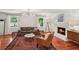 Comfortable living room featuring a brick fireplace and large windows at 3120 Mary Dr, Marietta, GA 30066