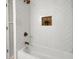 Beautiful bathroom features a subway tile surround and built-in shelving at 3288 Tarragon Dr, Decatur, GA 30034
