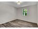 Bright bedroom with natural light and sleek gray wood-look flooring offers a peaceful retreat at 3288 Tarragon Dr, Decatur, GA 30034