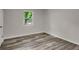 Bright bedroom with laminate floors, and view from window at 3288 Tarragon Dr, Decatur, GA 30034