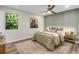 Cozy bedroom features stylish wall accents, a plush rug, and plenty of natural light at 3288 Tarragon Dr, Decatur, GA 30034