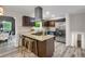 Modern kitchen with granite countertops, stainless steel appliances, and a stylish island with bar seating at 3288 Tarragon Dr, Decatur, GA 30034