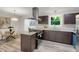Well-appointed kitchen with an island, modern appliances, and seamless connection to the dining area at 3288 Tarragon Dr, Decatur, GA 30034
