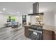 Modern kitchen with stainless steel appliances, granite countertops, and open layout to the living room at 3288 Tarragon Dr, Decatur, GA 30034