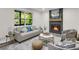 Cozy living room featuring a fireplace, stylish furniture, and ample natural light at 3288 Tarragon Dr, Decatur, GA 30034