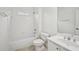 Bright white bathroom features a shower over bath and modern fixtures at 5066 Healey Dr, Smyrna, GA 30082