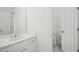 Bright white bathroom features a white vanity and tiled floors at 5066 Healey Dr, Smyrna, GA 30082