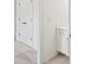 Modern bathroom with neutral carpet and tiled floors, a door, and a cabinet at 5066 Healey Dr, Smyrna, GA 30082