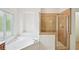 Bathroom featuring a soaking tub and tiled shower enclosure at 5066 Healey Dr, Smyrna, GA 30082