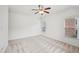Spacious bedroom with two windows for ample light and features neutral carpet and ceiling fan at 5066 Healey Dr, Smyrna, GA 30082