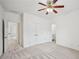 Spacious bedroom with neutral walls, patterned carpet, ceiling fan, walk in closet, and ensuite bathroom at 5066 Healey Dr, Smyrna, GA 30082