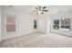 Spacious bedroom with three windows for ample light and features neutral carpet at 5066 Healey Dr, Smyrna, GA 30082